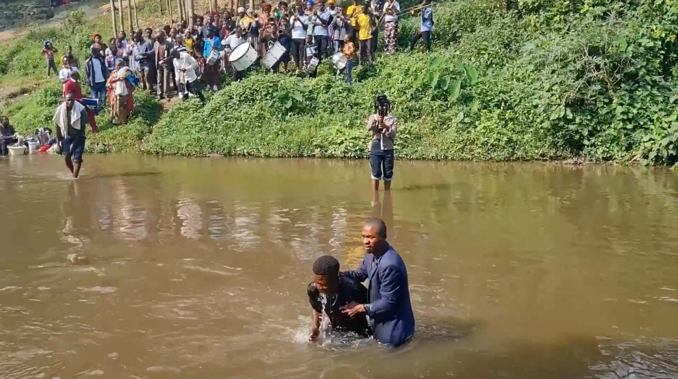 Singing, dancing and baptisms one year after deadly attack on church in DRC